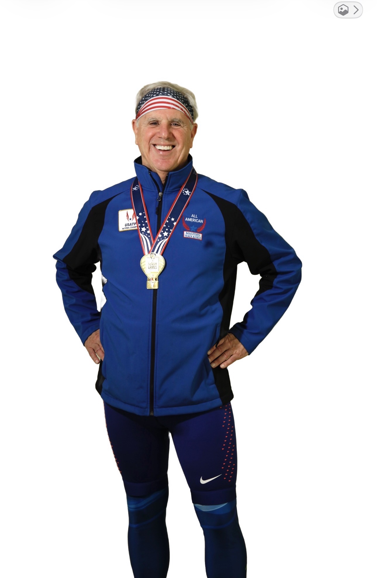 Founder Dan Williams wearing his athletic medals